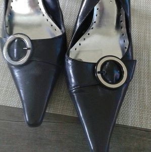 BCBG Pointed shoe with silver buckle.